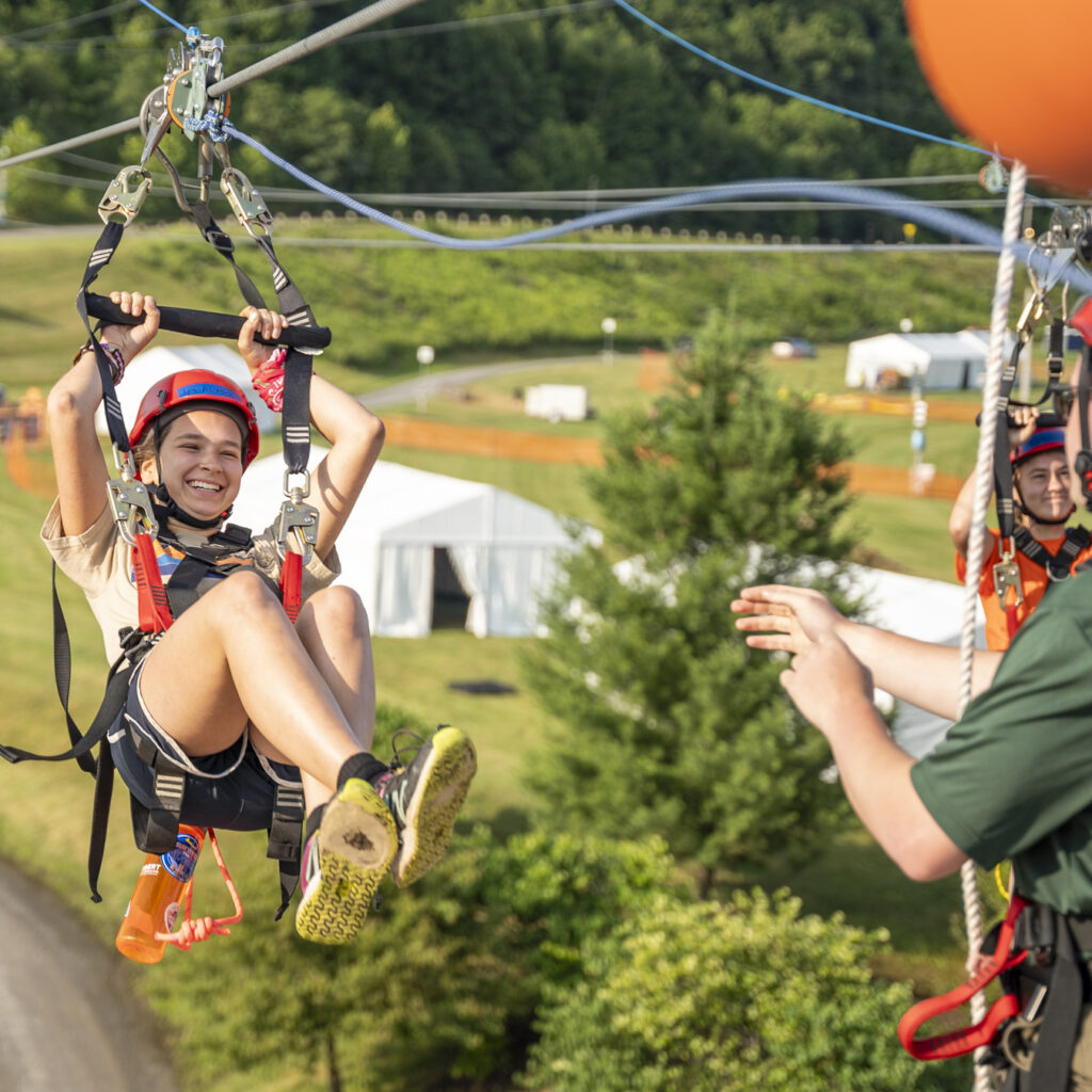 JST Alyssa Ross (Great Smokey Mountains Council) coming down the zipline at the 2023 National Jamboree / JST / Jamboree Service Team / Staff Member